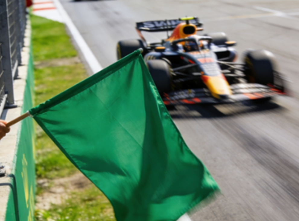 Green flag waving at an F1 race start