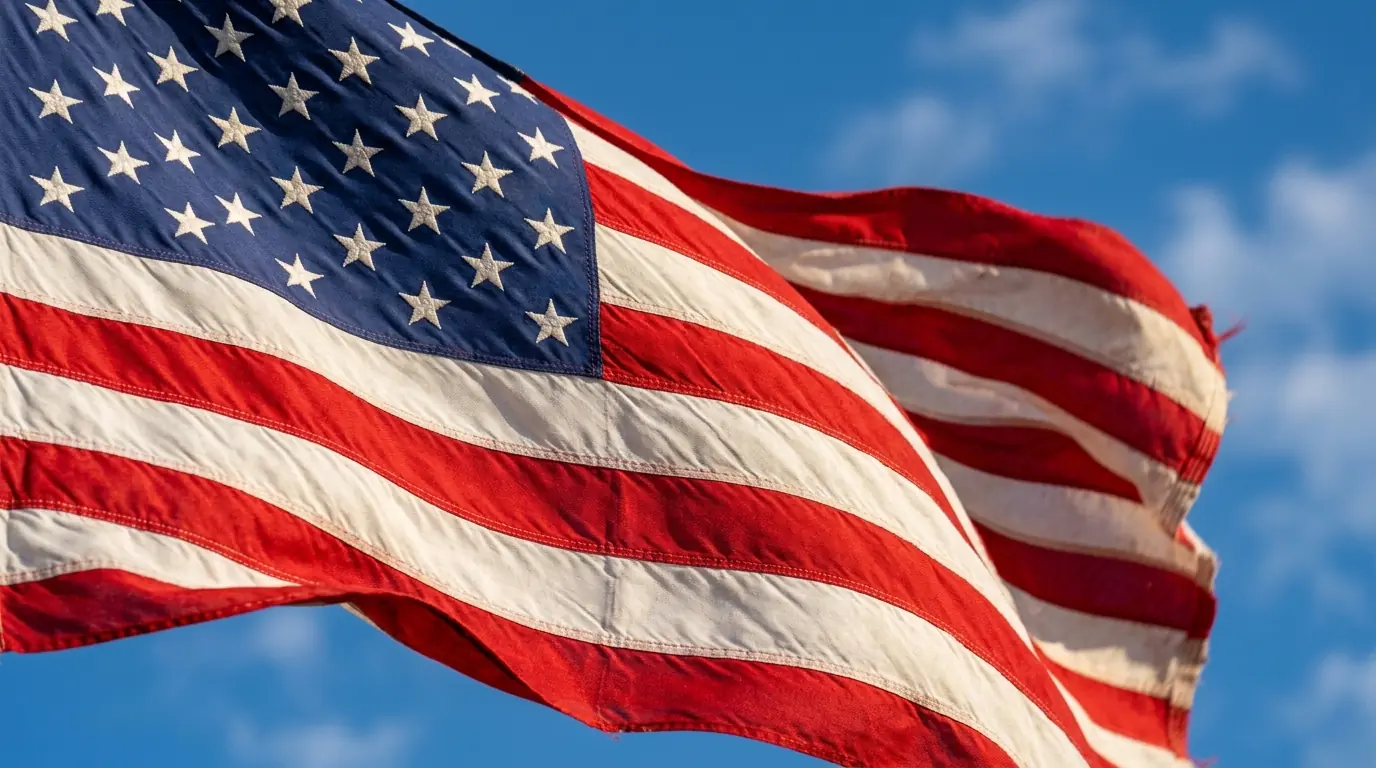 American flag rippling in light breeze showing fabric texture and vivid colors